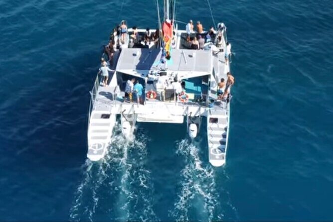 Board from Waikiki Beach for a scenic Sunset Sail on the Hwea - The Sum Up