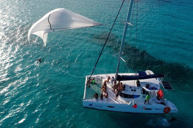 Catamaran Tour to Isla Mujeres, Open bar, Lunch, Snorkeling, Beach Club Included - Practical Details and Tips