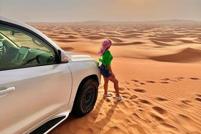 Desert Safari with Quad Bike Camel ride ,SandBoarding ,InalndSea - Dune Bashing and Quad Biking