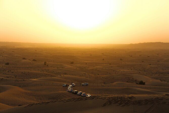 Dubai Desert Safari Dune Bashing, Camel Ride, Sandboarding & BBQ - Sunset and Arrival at the Bedouin Camp