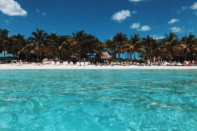 Live this unique experience. Catamaran to Isla Mujeres Tour. Open Bar included. - Analyzing the Itinerary in Detail