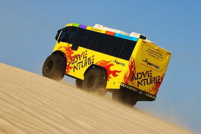 Monster Bus desert adventure: Dune bashing and sandboarding - Authentic Hospitality at Al Majles Resort