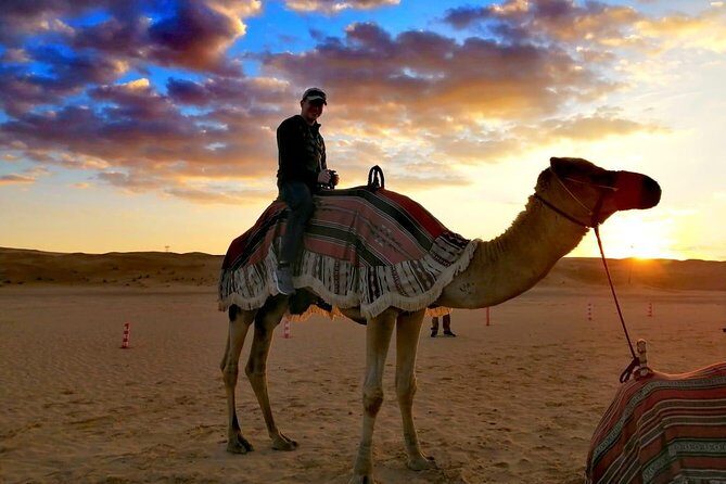 Morning Camel Trekking Over the Red Sand Dunes - Authenticity and Connection with Camels