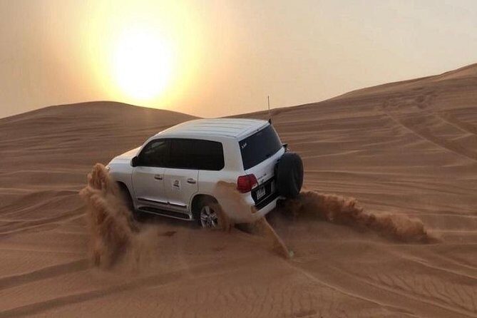 Premium Sundowner Red Dunes & Camel Safari with BBQ Dinner - Dune Bashing and Sandboarding: The Heartbeat of the Experience