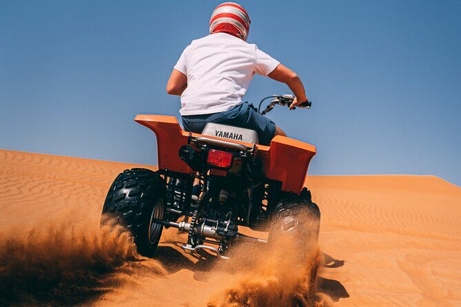 Red Dunes Quad Bike Safari, Sand surf, Camels and BBQ - The Sum Up