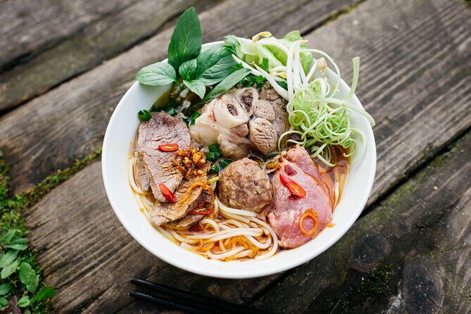 12 Tasting Street Food & Sightseeing By Scooter with Student - What Makes This Tour Stand Out?
