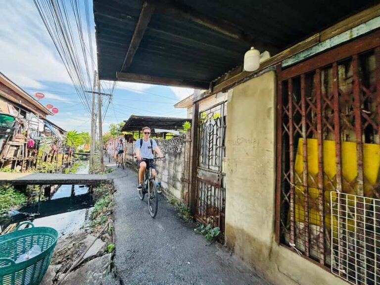 Bangkok: Temples, Canals & Local Life Bike Tour - Visiting Hidden Temples and Sacred Spots