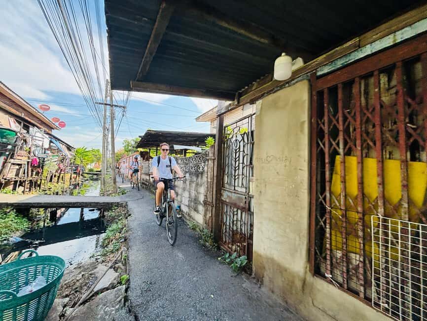 Bangkok: Temples, Canals & Local Life Bike Tour - Visiting Hidden Temples and Sacred Spots