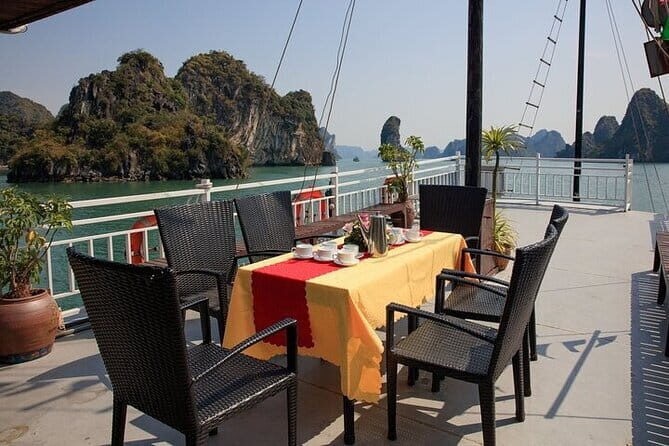 Halong bay 4 hours boat tour from Halong city with 2 caves, kayak - Practical Details: Transport, Pricing, and Inclusions
