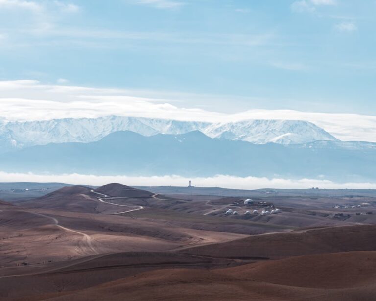 Agafay Desert with snow capped Atlas Mountains