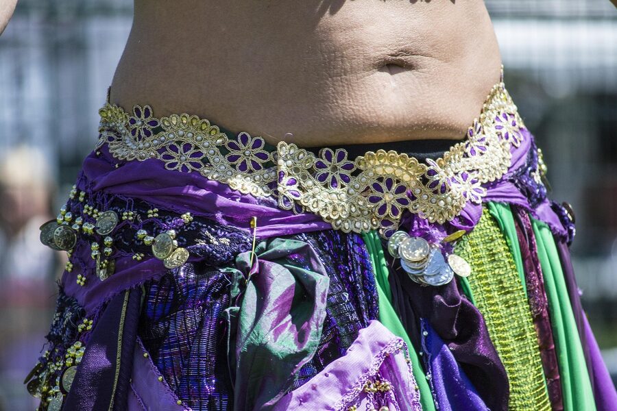 Arabic belly dancer performing traditional dance in costume