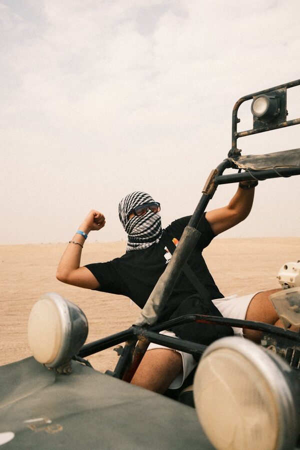 Person in headscarf on off-road vehicle