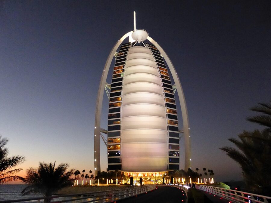Burj Al Arab luxury hotel with glamorous lighting at dusk