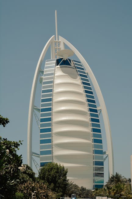 Burj Al Arab standing tall against clear blue sky
