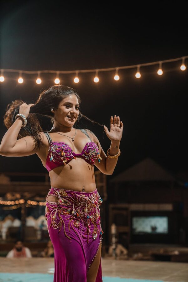 Belly dancer performing on stage at night