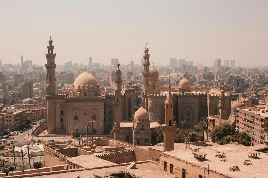 Aerial view of Cairo historic mosques with modern skyline