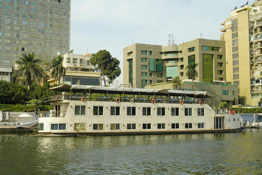 Cruise boat on the Nile in Cairo with modern buildings