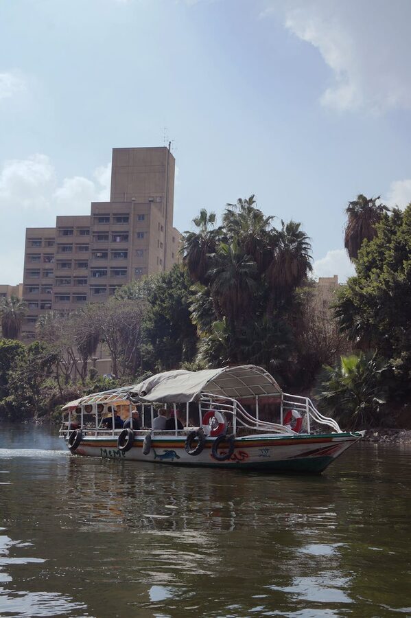Traditional boat cruising along the Nile in Cairo