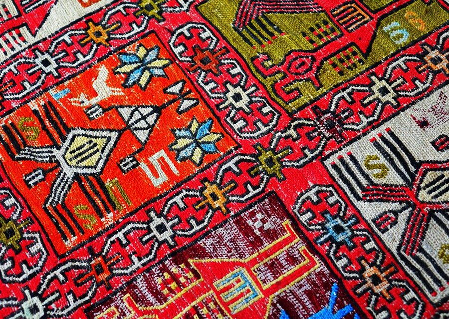 Persian rugs and carpets displayed in traditional shop