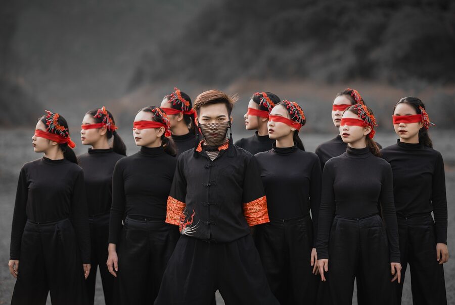 Choreographed dance group performing on stage