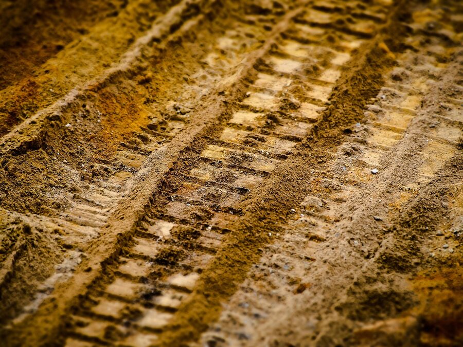 Desert track marks in sand from off-road vehicles