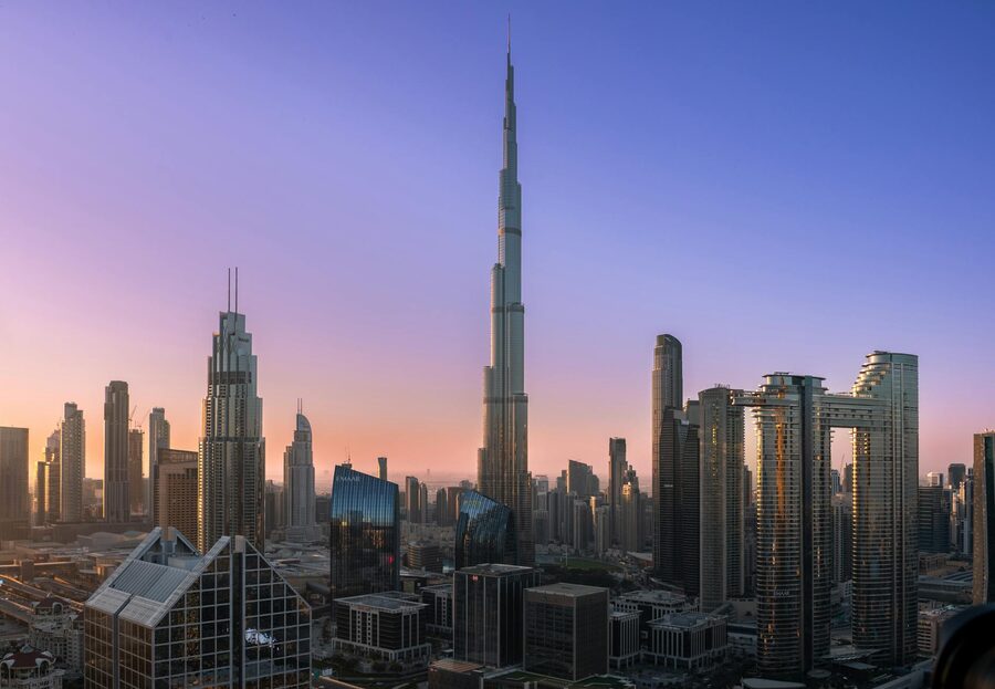 Burj Khalifa over Dubai skyline at sunrise