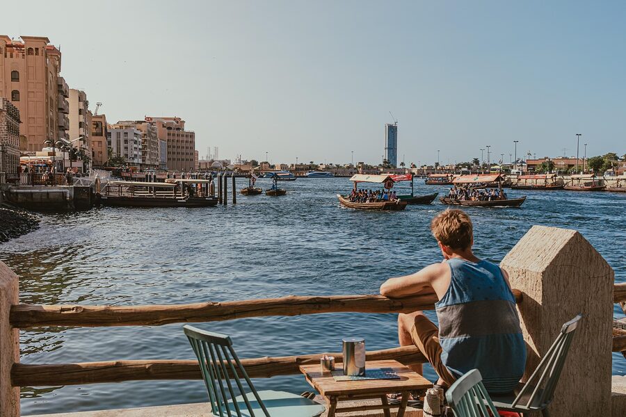 Traditional dhow boat on Dubai Creek with wooden design