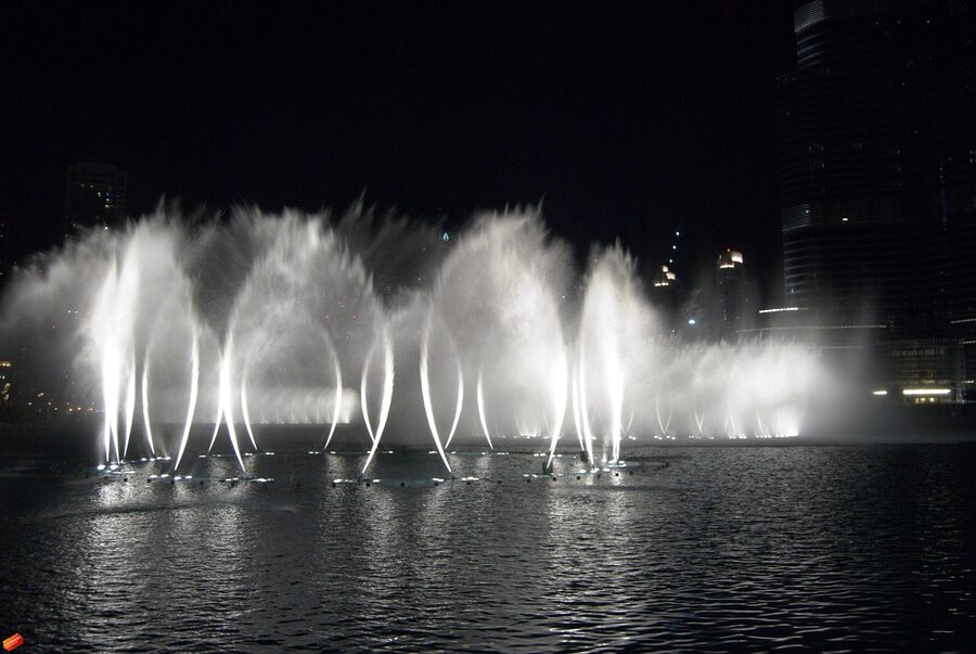 Dubai Fountain show at night with water jets illuminated
