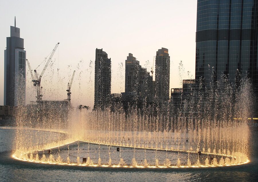 Dubai Fountain water show at night with illuminated jets near Burj Khalifa