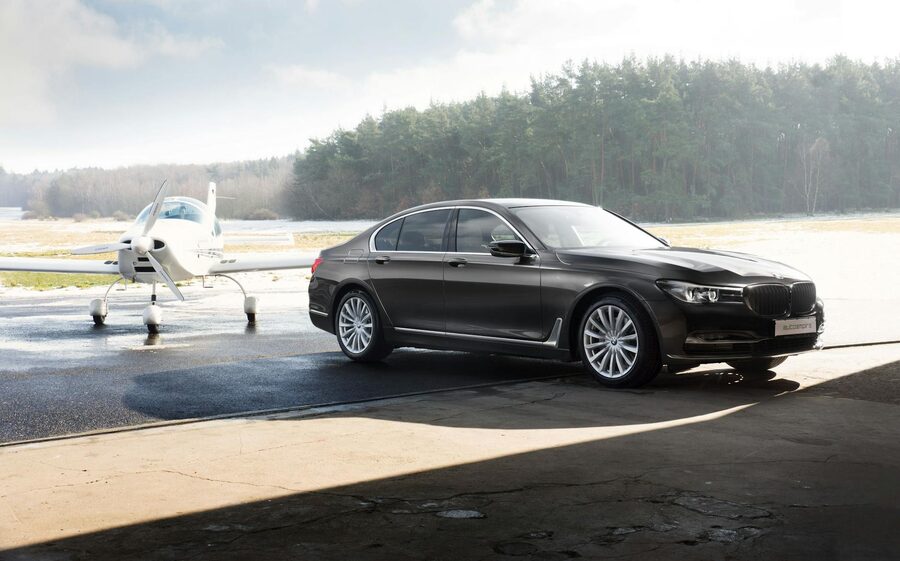 Luxury car parked at small airplane
