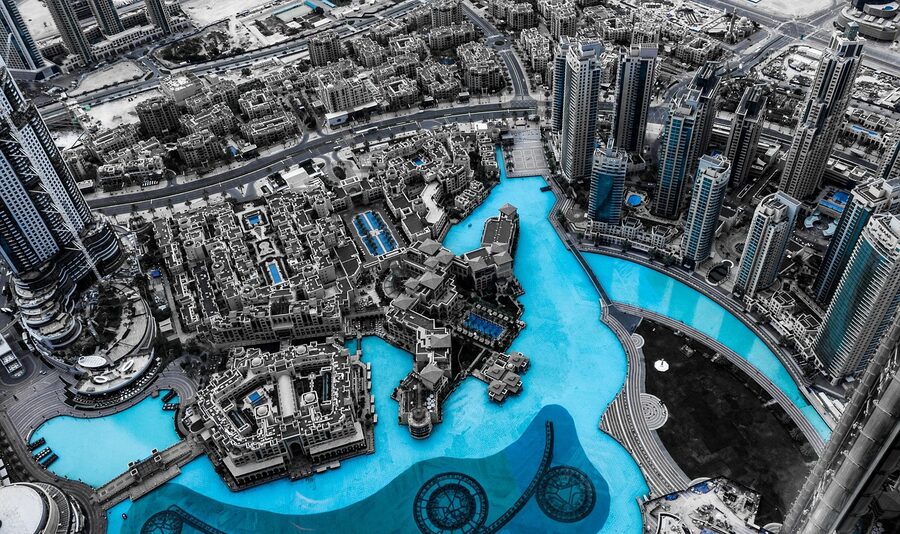 Dubai skyline with fountain view and city buildings at dusk