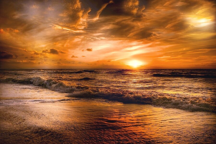 Dubai sunset with golden light reflecting on water surface