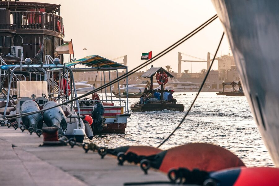Dubai Water Canal with boats and city buildings