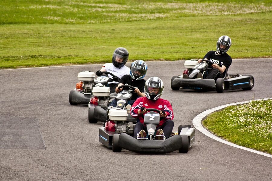 Go kart racing on track at amusement park