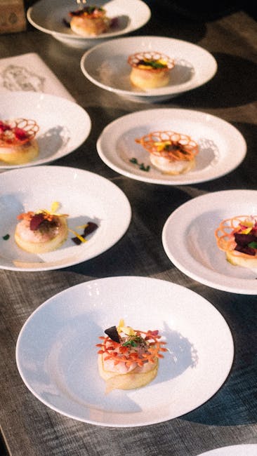 Beautifully plated gourmet dishes on white plates