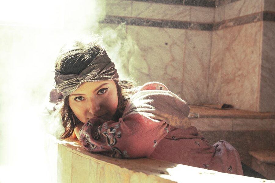 Woman in hammam relaxing ethereal light