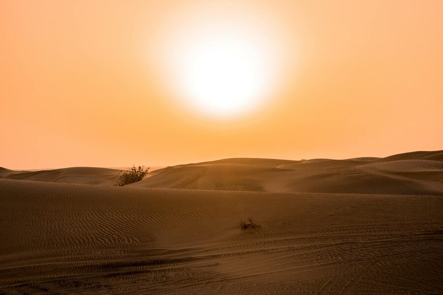 Sunset over sand dunes in the desert