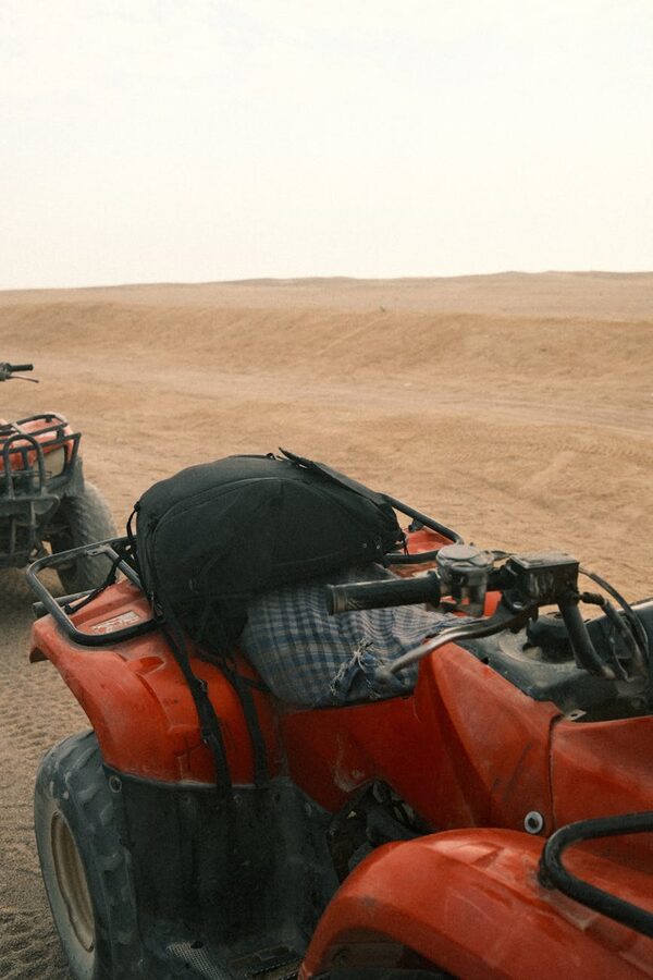 Quad bikes parked at a desert staging area
