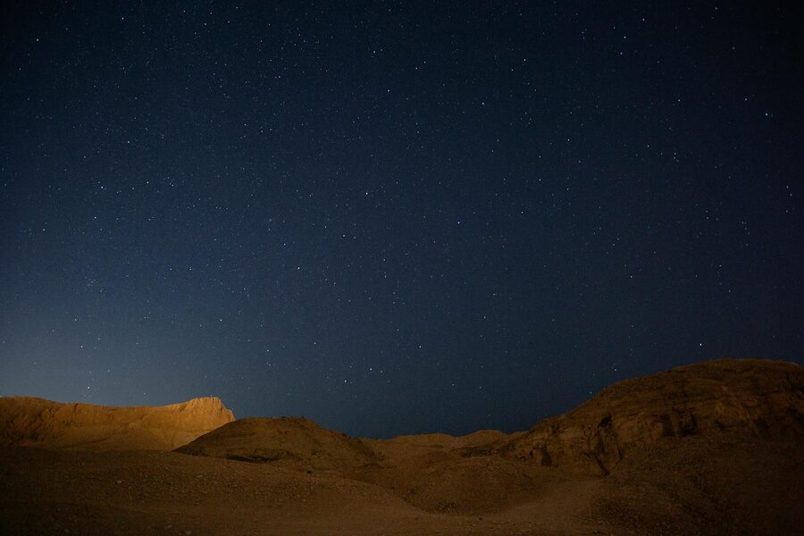 Starry night sky above desert hills in Esna Egypt