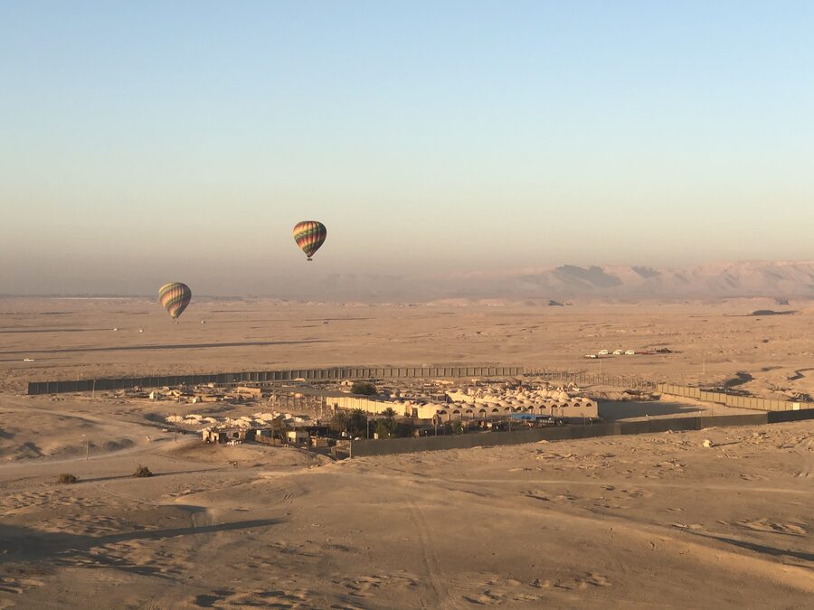 Multiple hot air balloons in the air over Luxor operated by Hod Hod Soliman