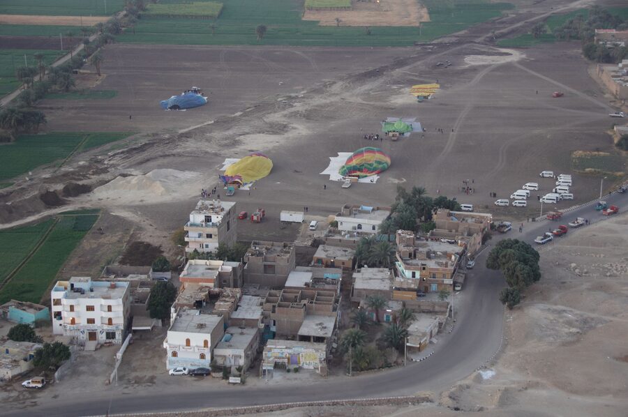 Close-up of single hot air balloon over Luxor farmland