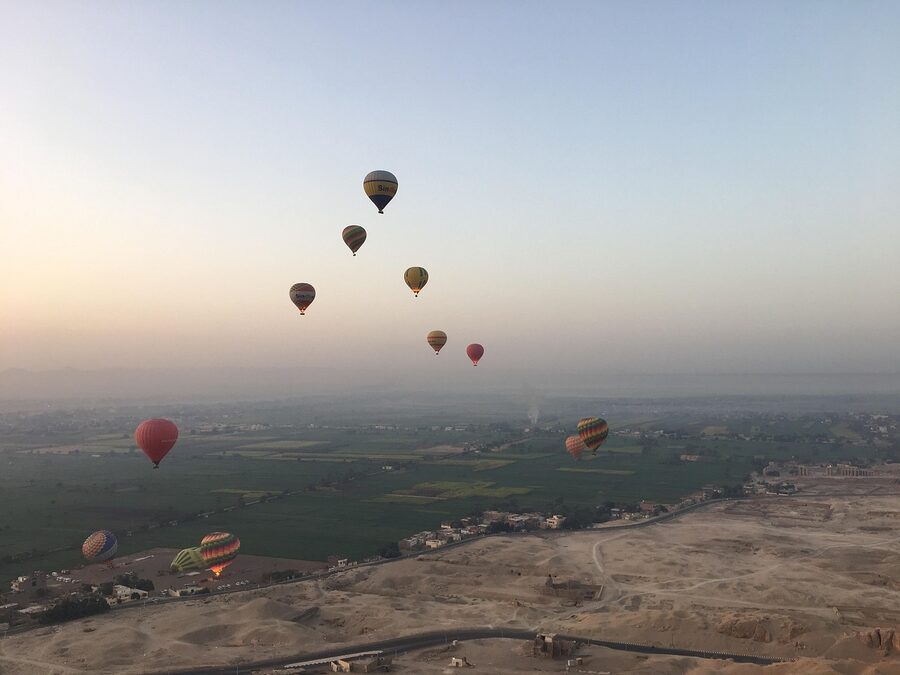 Hot air balloon over Valley of the Kings Egypt desert