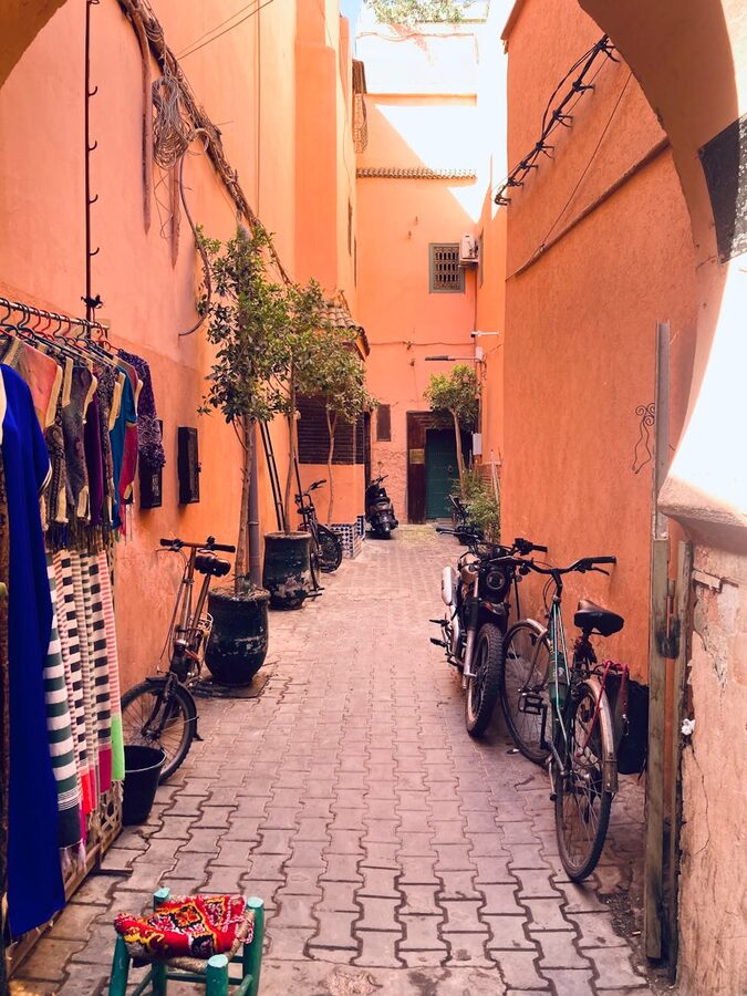 Marrakech alleyway with bicycles and textiles