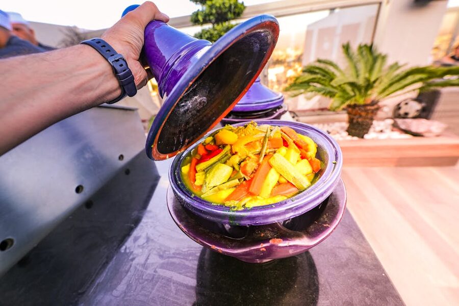 Vegetable tagine uncovered at table