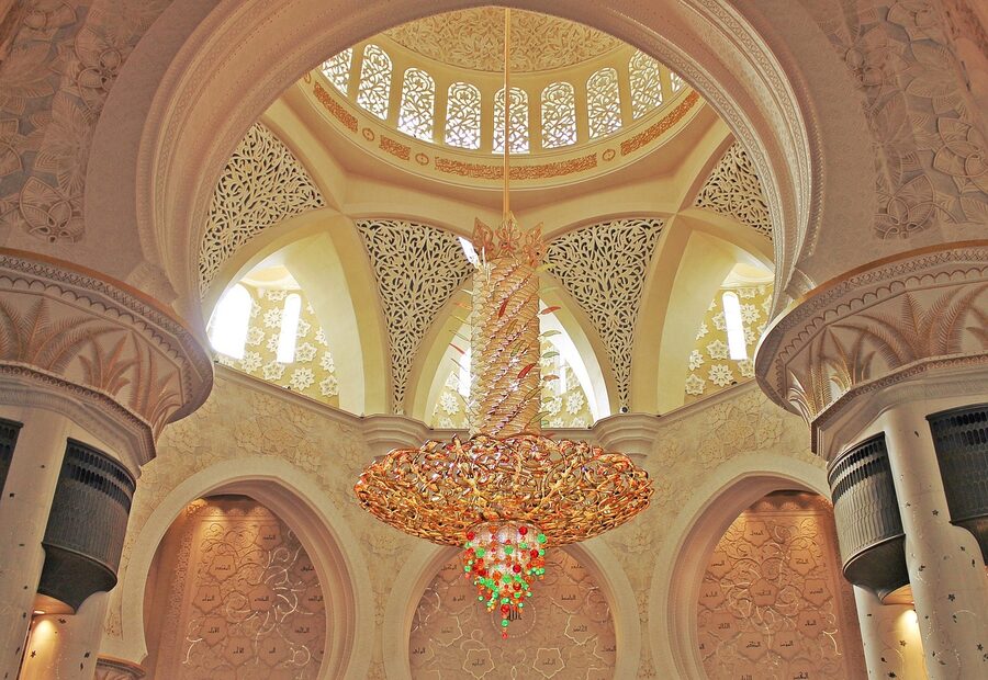 White marble interior of mosque with columns and arches