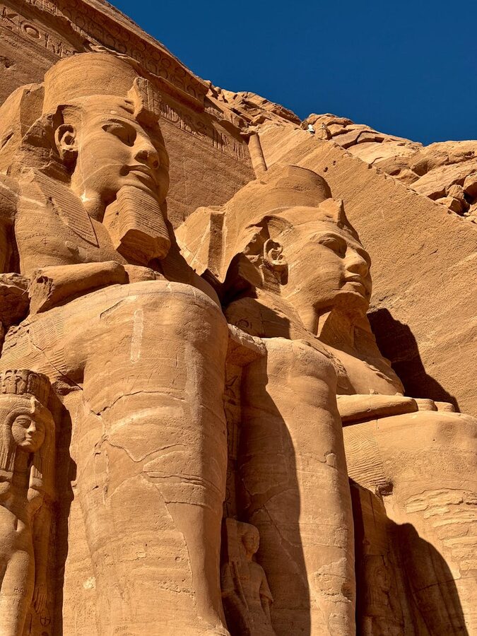 Abu Simbel Temple statues under clear blue sky