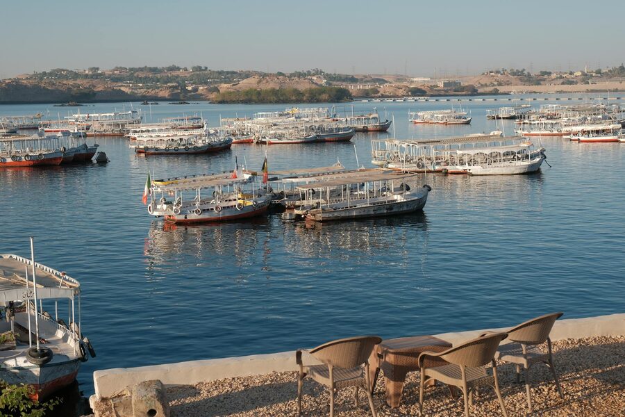 Traditional boats on the Nile at sunrise in Aswan