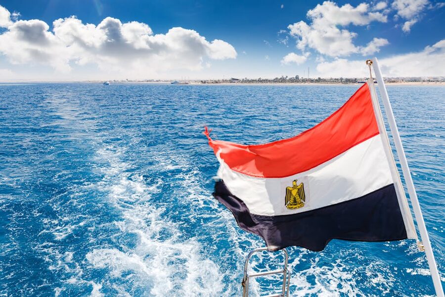 Egyptian flag on stern of snorkel boat with Red Sea in background