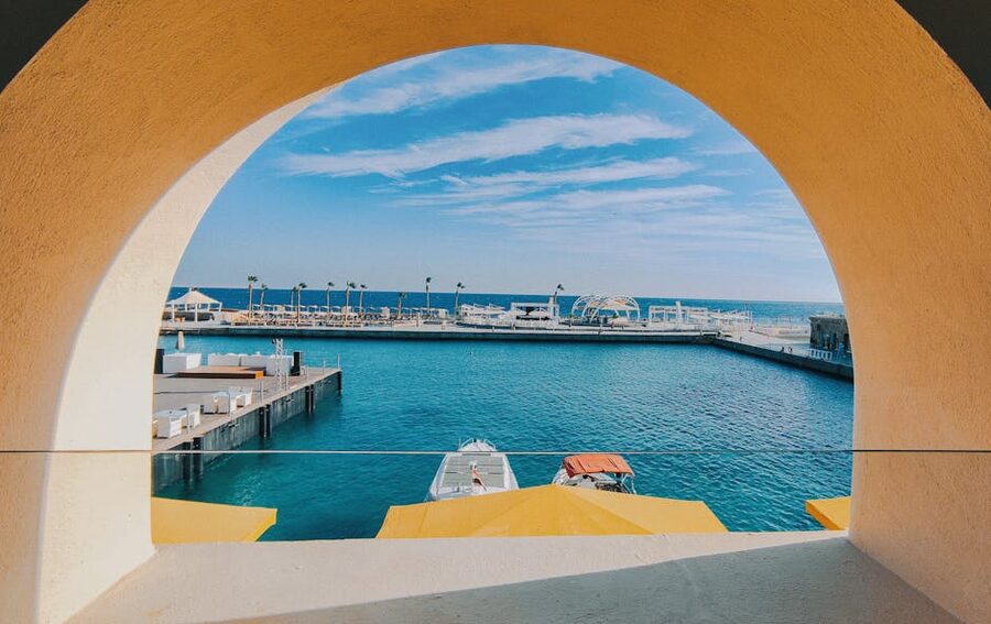 Hurghada Marina with yachts moored at docks and restaurants along the waterfront