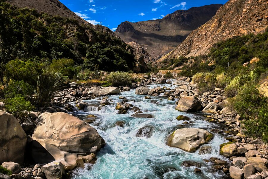 Mountain river flowing through rugged landscape